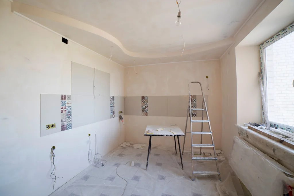 Kitchen renovation with new drywall ready for finishing